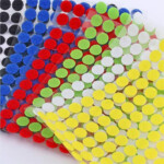 Adhesive backing hook and loop coins