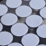 Adhesive backing hook and loop coins